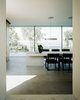 Modern home with Dining Room, Chair, Table, Gas Burning Fireplace, Ceiling Lighting, Limestone Floor, and Lamps. dining table Photo 4 of Villa Hohenlohe