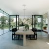 Modern home with Dining Room, Chair, Table, Limestone Floor, Gas Burning Fireplace, Lamps, and Ceiling Lighting. dining room Photo 3 of Villa Hohenlohe