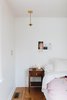 Modern home with Bedroom, Bed, Light Hardwood Floor, Night Stands, Accent Lighting, and Ceiling Lighting. Master Bedroom details Photo 9 of 1940's mid-century home gets a swift kick in the pants.