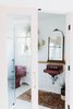 Modern home with Bath Room, Wall Mount Sink, Wall Lighting, and Enclosed Shower. Bathroom with french doors & original fixtures Photo 10 of 1940's mid-century home gets a swift kick in the pants.