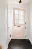 We were able to keep this fun original light fixture in the entry way and got the dutch doors to work again. So fun! Photo 12 of 1940's mid-century home gets a swift kick in the pants. modern home