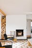 Modern home with Recessed Lighting, Light Hardwood Floor, and Chair. Living room After shot December 2018 - stucco fireplace with original wood burning insert. Photo 13 of 1940's mid-century home gets a swift kick in the pants.