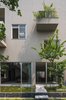 Modern home with Exterior. Ninh Binh house has a simple form, with reinforced concrete structure which is very popular in Vietnam, but designed to create a different kind of living space than the surrounding houses, closer to the nature. Photo 2 of Ninh Binh House