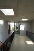 Modern home with Hallway and Medium Hardwood Floor. Steel stair leading to the rooftop vegetable garden. Photo 9 of Ninh Binh House
