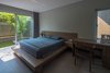 Modern home with Chair, Ceramic Tile Floor, and Ceiling Lighting. Taking advantage of the natural light, ventilation and greenery, the house has a pleasant atmosphere, friendly with the environment, saving the cost of lighting and air conditioning in living. Photo 11 of Ninh Binh House