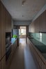 Modern home with Ceiling Lighting and Ceramic Tile Floor. The kitchen is separated from the common living space, suitable for the needs of the family. Photo 12 of Ninh Binh House