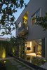 Modern home with Outdoor, Front Yard, Trees, and Shrubs. The garden has become an indispensable element of the house, rather than just a decorative element as it often is in the surrounding houses. Photo 17 of Ninh Binh House