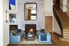 Modern home with Living Room, Rug Floor, Medium Hardwood Floor, Wall Lighting, Coffee Tables, Sofa, Standard Layout Fireplace, and Wood Burning Fireplace. A fireplace instills the Shinola Hotel with a sense of coziness and intimacy amid a high-energy atmosphere.
Photo 3 of The Shinola Hotel