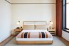 Modern home with Bedroom, Bed, Night Stands, Medium Hardwood Floor, Rug Floor, and Wall Lighting. A cheerful striped blanket is among the custom Shinola features in guestrooms.
Photo 8 of The Shinola Hotel