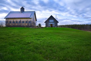 The new addition is in perfect harmony with the barn erected over 30 years ago.    