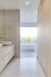 The master bath, featuring a freestanding bathtub and stellar views.