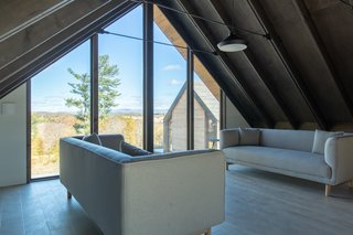 Along with a three-car garage, a chill-out loft space for hot yoga and musical jam sessions is a perk of the carriage house.