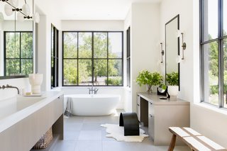 The master bathroom is one of Geremia’s favorite rooms. “It’s focused on ritual and relaxation—a special place to start and end the day,” she says. “You can watch the neighboring horses graze from the outdoor shower.”