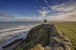 Downhill Strand in County Londonderry, Northern Ireland. Mussenden Temple is perched on cliffs above the beach.
