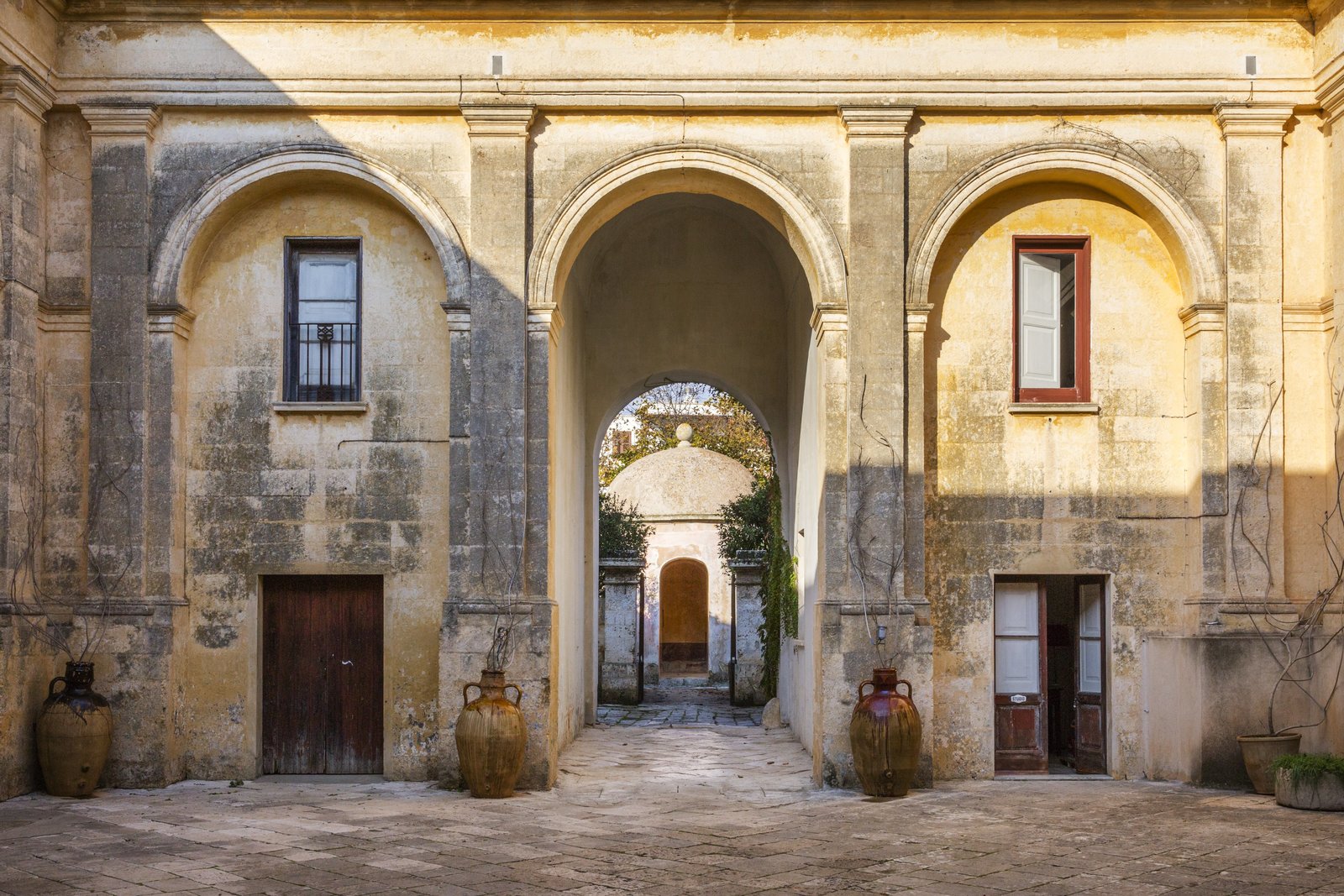 Palazzo Daniele's stunning courtyard. In the distance is the circular-domed Kaffeehaus, a one-time aristocratic hangout where guests can now savor candle-lit dinners.