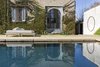 Modern home with Outdoor, Large Patio, Porch, Deck, and Stone Patio, Porch, Deck. The pool, seen through the arched entryway of the kitchen. Photo 14 of Palazzo Daniele