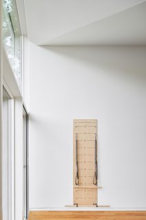 Fitness is important to the couple, and so a Pilates Springboard was installed in the upper extension, giving the multi-functional space yet another purpose.