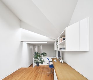 Upstairs, the light-refracting faceted ceiling is the design highlight.