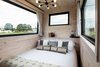 Modern home with Bedroom, Bed, and Ceiling Lighting. Custom curtains and a matte black chandelier add layers of texture to the bedroom area, anchored by a Hawkins bed. Photo 9 of Outlook Shelter