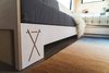 Modern home with Living Room, Vinyl Floor, and Sofa. Custom CNC-cut Baltic Birch built-ins spawned the pull-out sofa, as well as the bed frame in the distance. "Built-in couches, closets, and cabinetry are a big part of all our units," says Brian Buzarde, co-founder of Land Ark RV. Photo 5 of Outlook Shelter