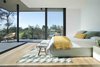 Modern home with Bedroom, Storage, Night Stands, Bed, Bench, Chair, Ceiling Lighting, Medium Hardwood Floor, Table Lighting, and Light Hardwood Floor. La Vinya, PGA Golf Resort | Studio RHE Photo 6 of La Vinya, PGA Golf Resort