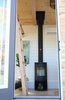 Modern home with Living Room, Recessed Lighting, Wood Burning Fireplace, and Laminate Floor. The Morso wood burning stove is centered in front of the door and can be seen through the glass panel. It is a features from both in and outside the home. Photo 5 of Innisfree Anarres
