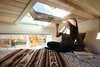 Modern home with Bedroom, Recessed Lighting, Bed, and Plywood Floor. The master bedroom loft features an abundance of windows including this venting roof window by Velux. Photo of Innisfree Anarres