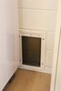 A close up photo of the cat door in the bathroom. Photo 15 of Innisfree Anarres modern home