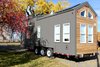 Modern home with Exterior, Tiny Home Building Type, Metal Roof Material, Wood Siding Material, A-Frame RoofLine, and Metal Siding Material. The back of the tiny home carries a sleek design with steel grey cladding while the cedar is integrated with a modern and bold fascia line. Photo 19 of Innisfree Anarres