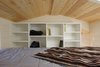 Modern home with Bedroom, Storage, Recessed Lighting, Bed, and Plywood Floor. To add privacy and storage, the master loft houses a large shelf unit that backs onto the kitchen area. Photo 2 of Innisfree Anarres