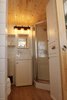 Modern home with Laminate Floor. The bathroom also houses a 36"x36" neoangle shower and a large storage cabinet that houses the electric hot water tank and clothing. Photo 12 of Innisfree Anarres