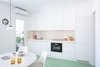 Modern home with Kitchen, Tile Counter, Recessed Lighting, Wall Oven, Ceramic Tile Backsplashe, White Cabinet, Microwave, Refrigerator, Drop In Sink, Pendant Lighting, and Dishwasher. Kitchen Photo 5 of Apartamento Picasso