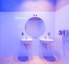 Modern home with Concrete Floor, Recessed Lighting, Accent Lighting, and Ceiling Lighting. The lighting in the bathroom creates suggestive blue gradients. Photo 13 of IMOOD Restaurant