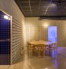 Modern home with Dining Room, Chair, Table, Accent Lighting, Wall Lighting, Concrete Floor, and Track Lighting. The bathroom lighting floods the room with blue. Photo 11 of IMOOD Restaurant