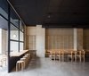Modern home with Dining Room, Concrete Floor, Table, Bench, Chair, Track Lighting, Wall Lighting, and Stools. Casual dining area. Photo 2 of IMOOD Restaurant