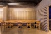Modern home with Dining Room, Track Lighting, Chair, Concrete Floor, Table, Bench, and Ceiling Lighting. The wooden furniture contrasts with the roughness of the cement. Photo 6 of IMOOD Restaurant