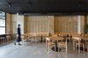 Modern home with Dining Room, Wall Lighting, Concrete Floor, Bench, Stools, Track Lighting, Table, and Chair. The wood stands out in a cement box. Photo 3 of IMOOD Restaurant