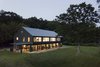 Modern home with Exterior, Wood Siding Material, House Building Type, Glass Siding Material, A-Frame RoofLine, and Metal Roof Material. Main House Photo 6 of 2 Barns