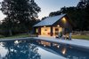 Modern home with Outdoor, Swimming Pools, Tubs, Shower, Garden, Hardscapes, Trees, Large Patio, Porch, Deck, Concrete Patio, Porch, Deck, Wood Fences, Wall, Side Yard, Stone Patio, Porch, Deck, Large Pools, Tubs, Shower, and Lap Pools, Tubs, Shower. Pool House Photo 4 of 2 Barns
