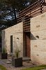 Modern home with Exterior, Stone Siding Material, House Building Type, and Flat RoofLine. Entry court gate, plate steel canopy Photo 3 of MM31