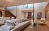 Modern home with Living Room, Sofa, Coffee Tables, Chair, Light Hardwood Floor, and Ceiling Lighting. Living/dining space looking toward entry Photo 8 of MM31