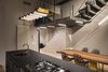 Modern home with Ceiling Lighting, Light Hardwood Floor, and Track Lighting. Kitchen, ZAG lamp and BAU table Photo 20 of Blue and concrete apartment