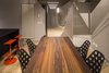 Modern home with Dining Room, Chair, Accent Lighting, Track Lighting, Light Hardwood Floor, and Table. BAU table Photo 17 of Blue and concrete apartment