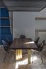 Modern home with Dining Room, Chair, Table, Track Lighting, and Light Hardwood Floor. BAU table Photo 5 of Blue and concrete apartment