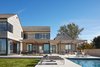 Modern home with Outdoor, Pavers Patio, Porch, Deck, Swimming Pools, Tubs, Shower, Back Yard, and Wood Patio, Porch, Deck. View of Outdoor pool and kitchen, looking East Photo 5 of St Joseph Beachfront Home
