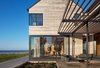 Modern home with Exterior, Shed RoofLine, Beach House Building Type, House Building Type, and Wood Siding Material. Looking North into the Dining Room Photo 4 of St Joseph Beachfront Home