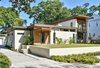 Modern home with Exterior, Glass Siding Material, House Building Type, Stucco Siding Material, and Flat RoofLine. Mount Pleasant Modern: Street View Photo of Mount Pleasant Modern