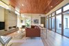 Modern home with Living Room, Recessed Lighting, Sofa, Table Lighting, Light Hardwood Floor, Ceiling Lighting, Coffee Tables, Ribbon Fireplace, Chair, Accent Lighting, and Console Tables. Mount Pleasant Modern: Living Room Photo 6 of Mount Pleasant Modern