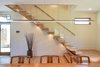 Modern home with Staircase, Wood Tread, and Glass Railing. Mount Pleasant Modern: Stairs Photo 10 of Mount Pleasant Modern