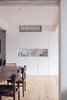 Modern home with Dining Room, Chair, Medium Hardwood Floor, Recessed Lighting, and Table. dining/living area Photo 6 of Quarry Bay Residence